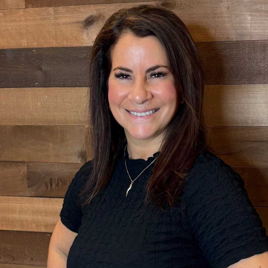 Portrait of Amy, a professional stylist at Laschi Hairstylists & Day Spa, showcasing their expertise and style.